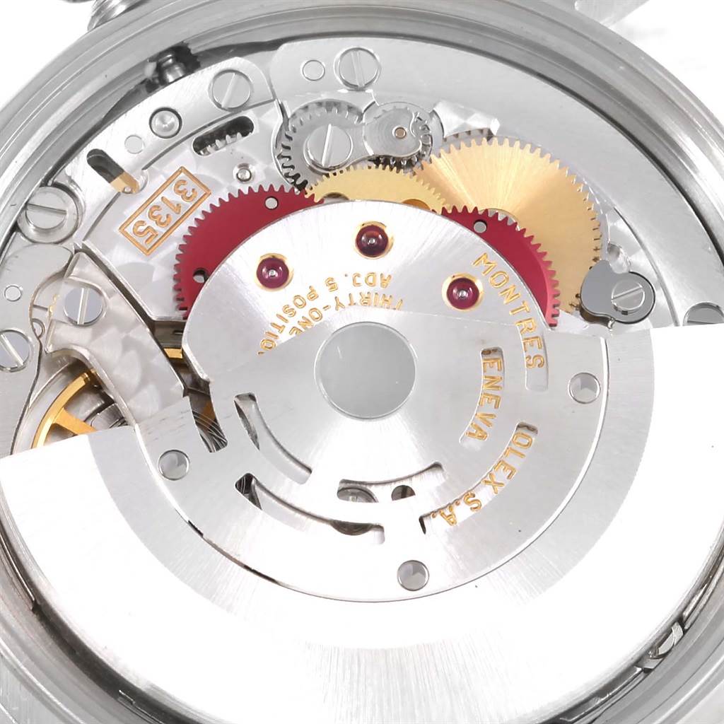 The image shows the inner mechanism of a Rolex Date 15210 Men's Stainless Steel Black Dial 15210 Men's Stainless Steel Black Dial model watch, including gears and the balance wheel.