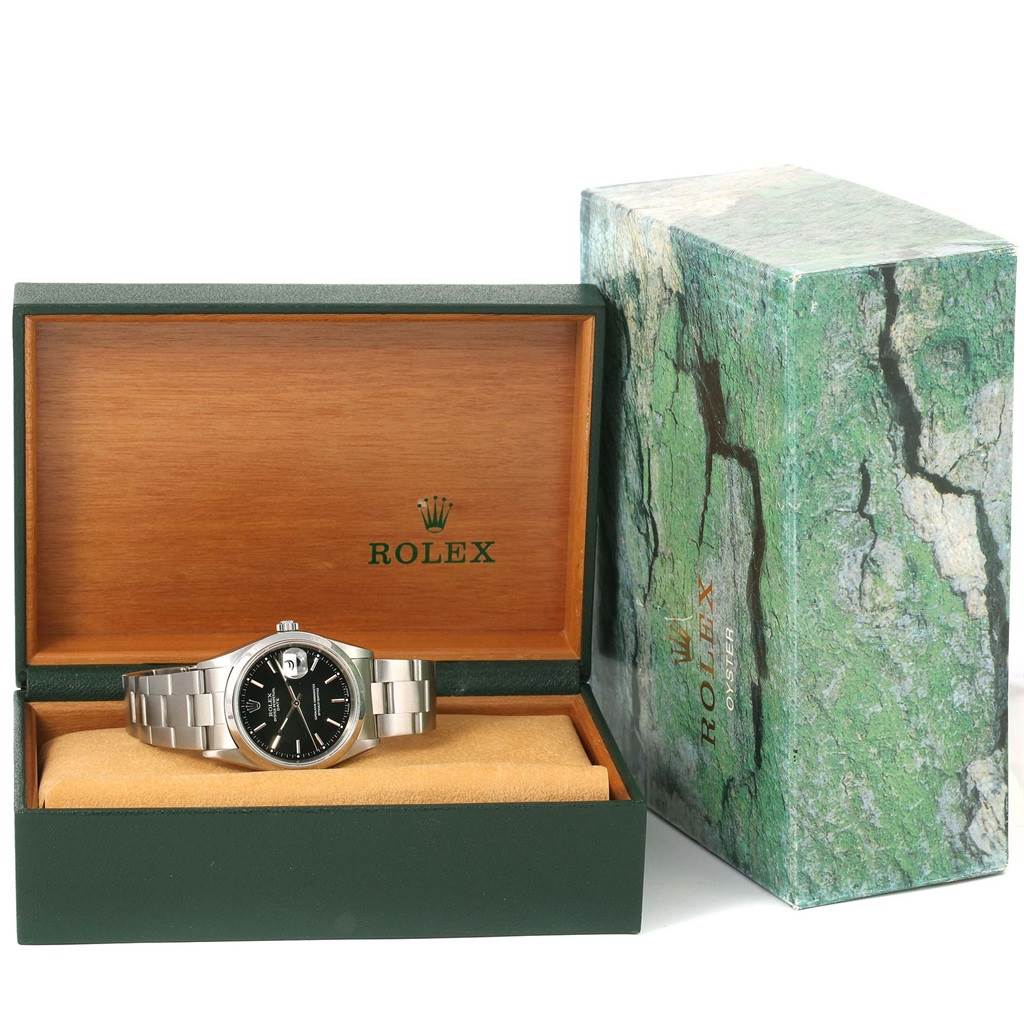 The image shows a Rolex Date 15200 Men's Stainless Steel Black Dial 15200 Men's Stainless Steel Black Dial watch in its open green and wooden box beside its green outer box.