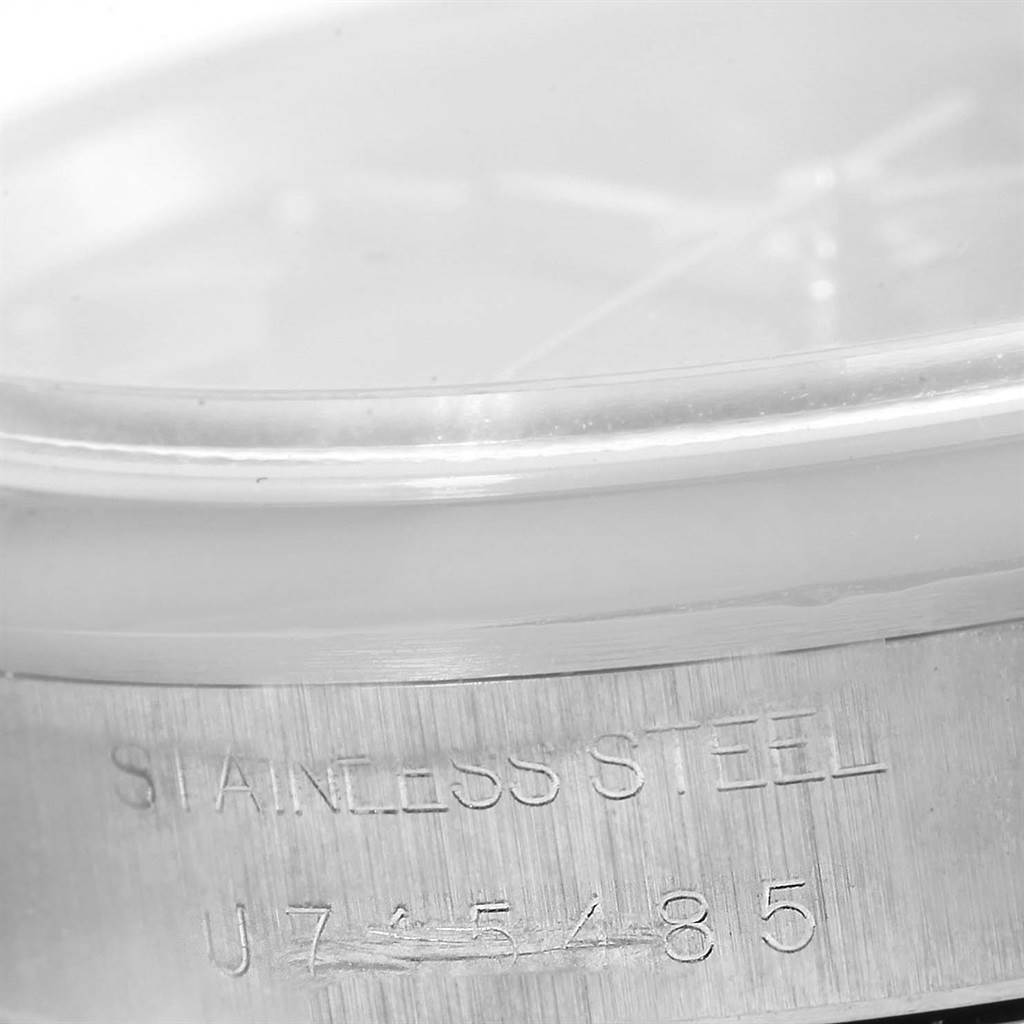 The image shows a close-up of the case side of a stainless steel Rolex Date 15200 Men's Stainless Steel Black Dial 15200 Men's Stainless Steel Black Dial model, featuring serial number engraving.
