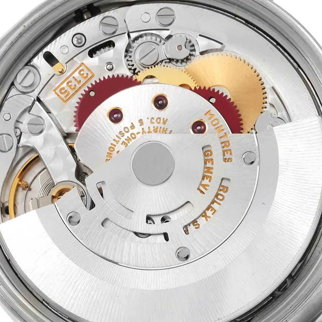 The image shows the intricate internal mechanical movement of a Rolex Date 15210 Men's Stainless Steel Black Dial 15210 Men's Stainless Steel Black Dial model watch.