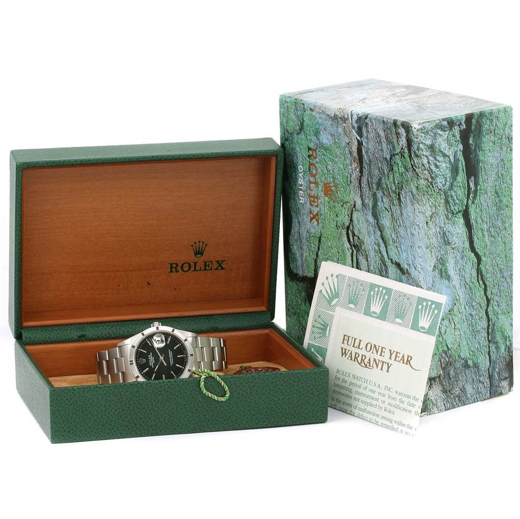 The image shows a Rolex Date 15210 Men's Stainless Steel Black Dial 15210 Men's Stainless Steel Black Dial model watch in its open box with warranty papers and outer packaging visible.