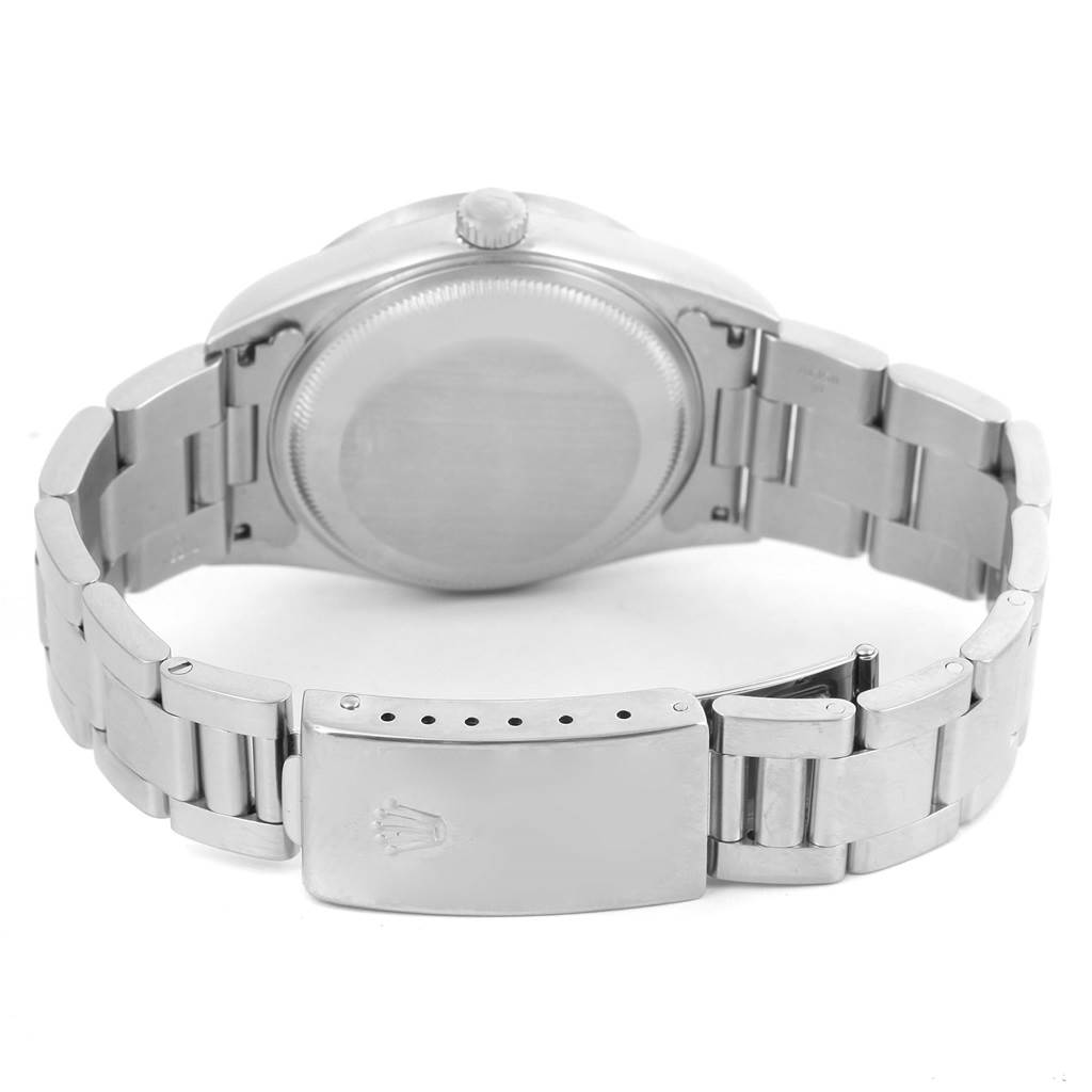 The image shows the back view of the Rolex Date 15210 Men's Stainless Steel Black Dial 15210 Men's Stainless Steel Black Dial model watch, focusing on the clasp, bracelet, and case back.