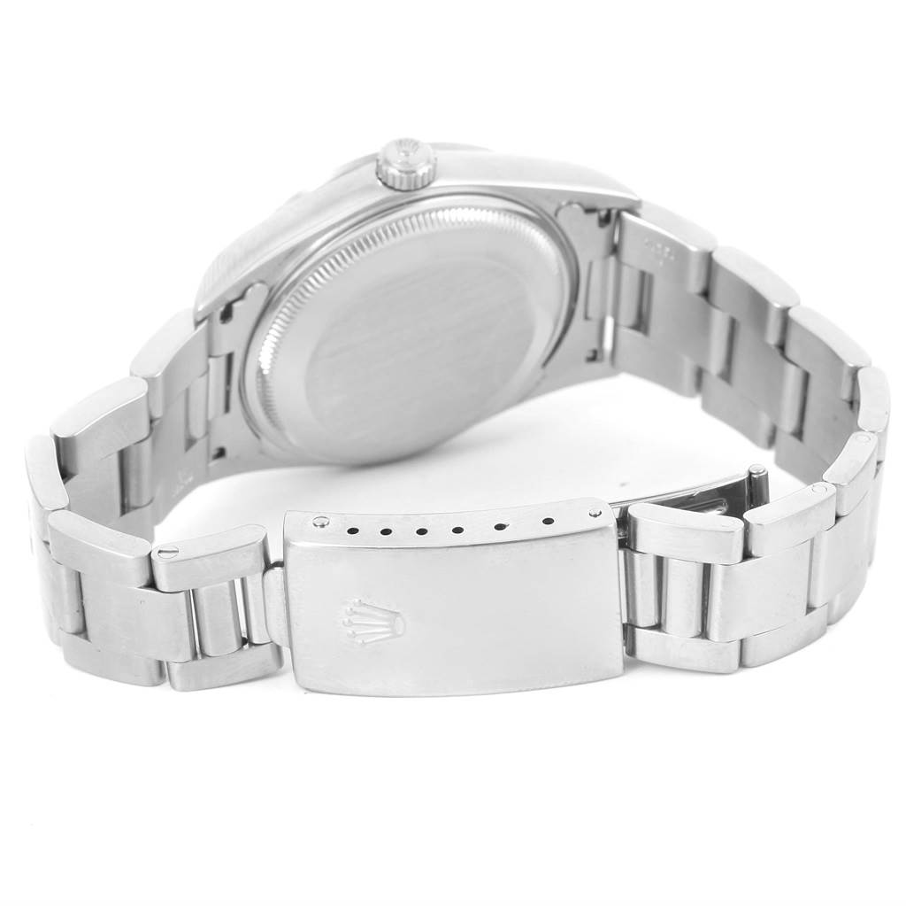 The image shows the backside of a Rolex Date 15200 Men's Stainless Steel White Dial 15200 Men's Stainless Steel White Dial model watch, highlighting its stainless steel bracelet and clasp.