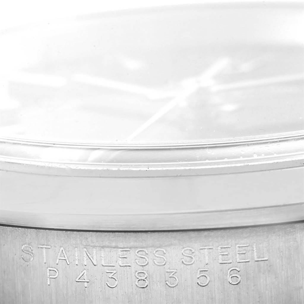 The image shows the model number and bottom part of the case for the Date model by Rolex from a close-up angle.