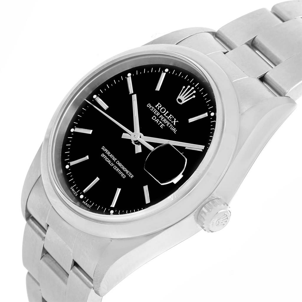 The image shows a Rolex Oyster Perpetual Date watch from an angled side view, highlighting its black dial, case, and bracelet.