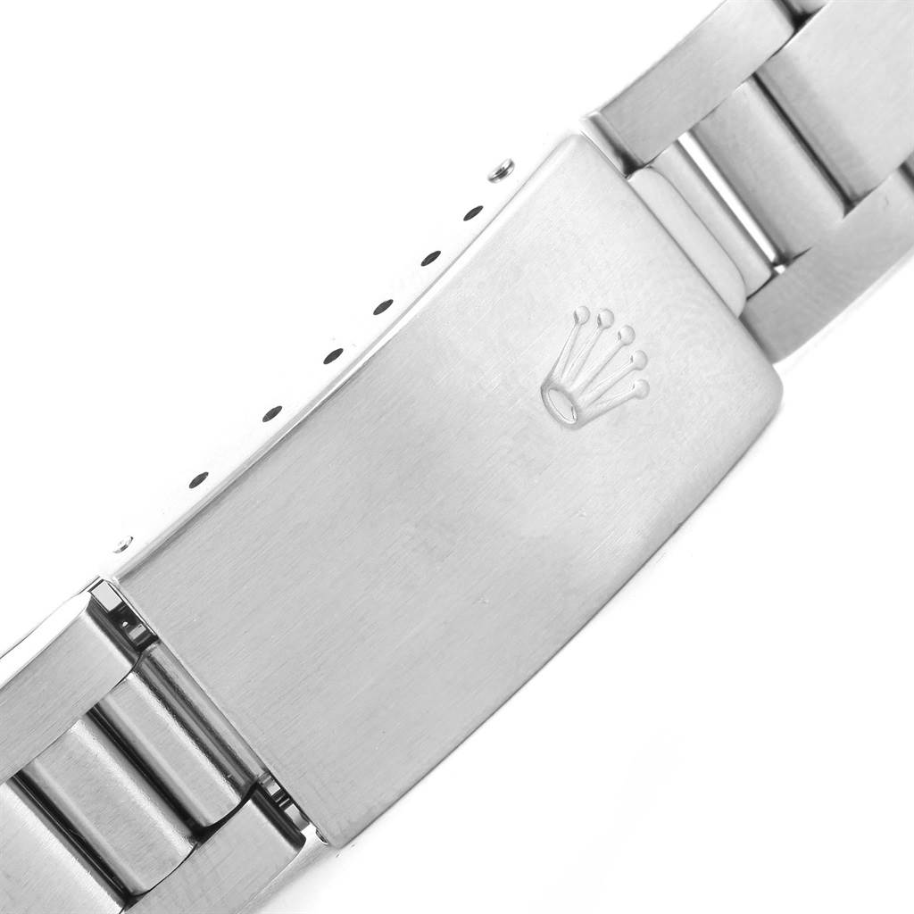 This image shows a close-up of the clasp of a Rolex Date 15200 Men's Stainless Steel Black Dial 15200 Men's Stainless Steel Black Dial watch, highlighting the Rolex crown logo.