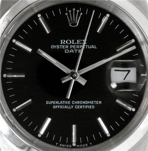 The image shows a close-up of the Rolex Oyster Perpetual Date watch face, highlighting the date window, hour markers, and hands.