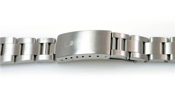 This image shows a close-up of the stainless steel bracelet and clasp of a Rolex Date 15000 Men's Stainless Steel  15000 Men's Stainless Steel  model watch.