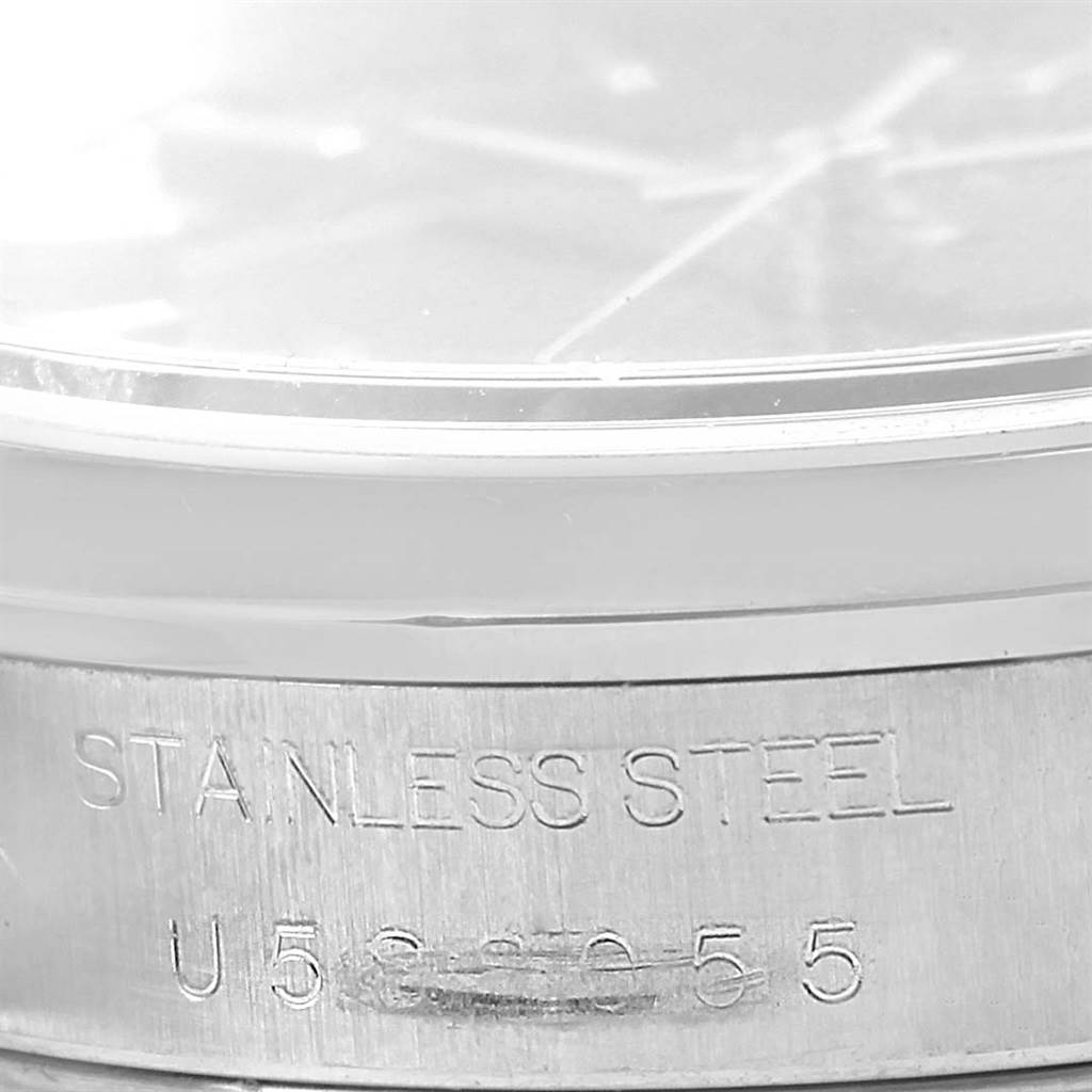 The image shows a close-up of the serial number and "STAINLESS STEEL" engraving on a Rolex Date 15200 Men
s Stainless Steel Black Dial 15200 Men
s Stainless Steel Black Dial model watch case.
