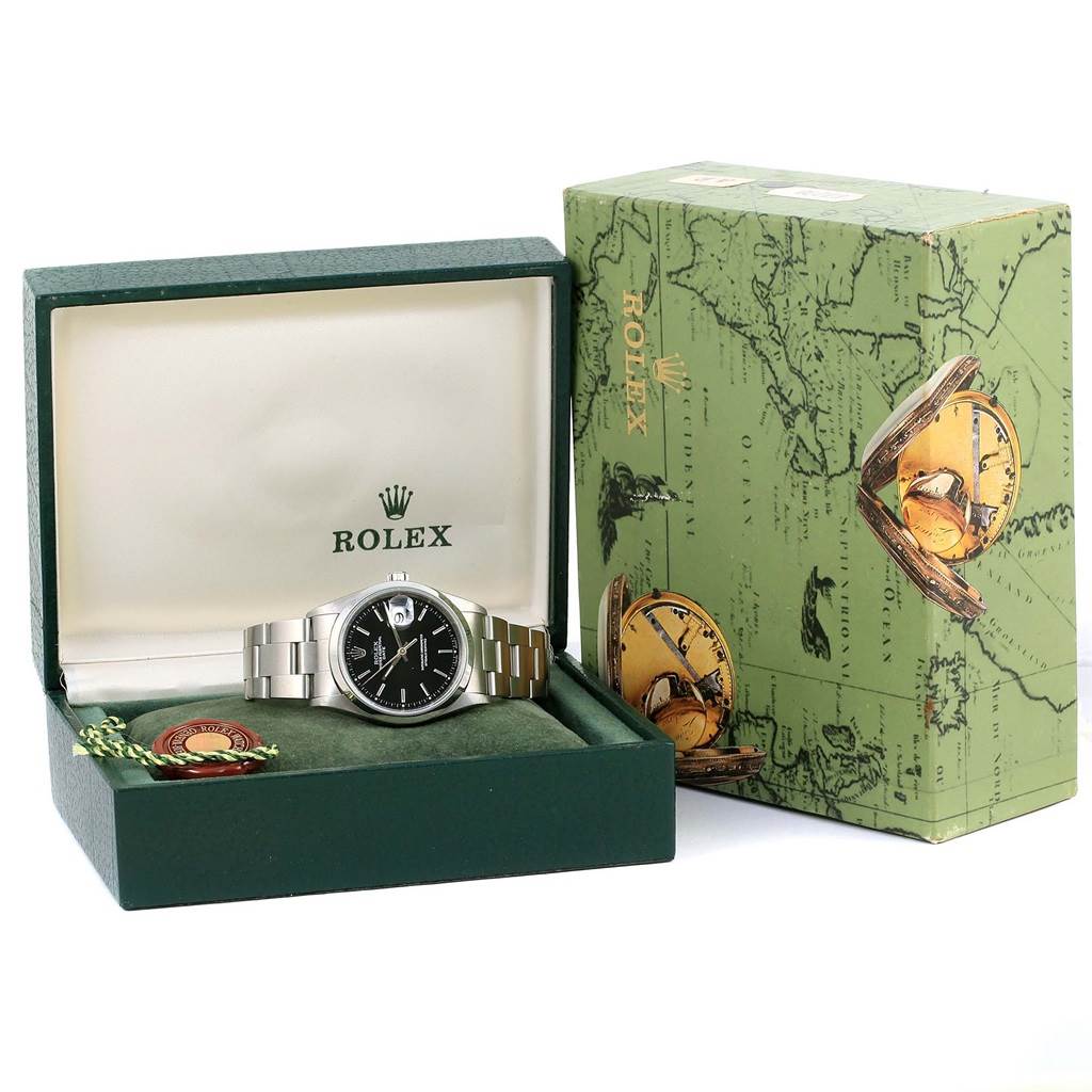 The image shows a Rolex Date 15200 Men
s Stainless Steel Black Dial 15200 Men
s Stainless Steel Black Dial model watch in its opened box, displayed at a slight angle, next to its green outer packaging.