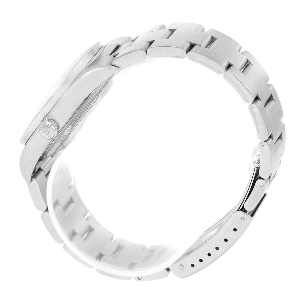 The image shows a Rolex Date 15210 Men's Stainless Steel White Dial 15210 Men's Stainless Steel White Dial model watch from the side, highlighting the case, crown, and bracelet.