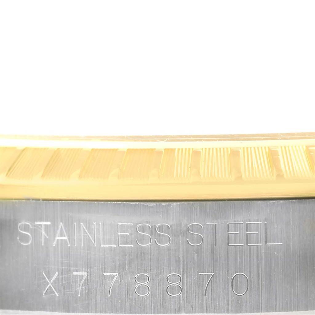 This is a close-up of the stainless steel casing with the serial number on a Rolex Date 15223 Men
s Steel and Gold (two tone) White Dial 15223 Men
s Steel and Gold (two tone) White Dial model watch.