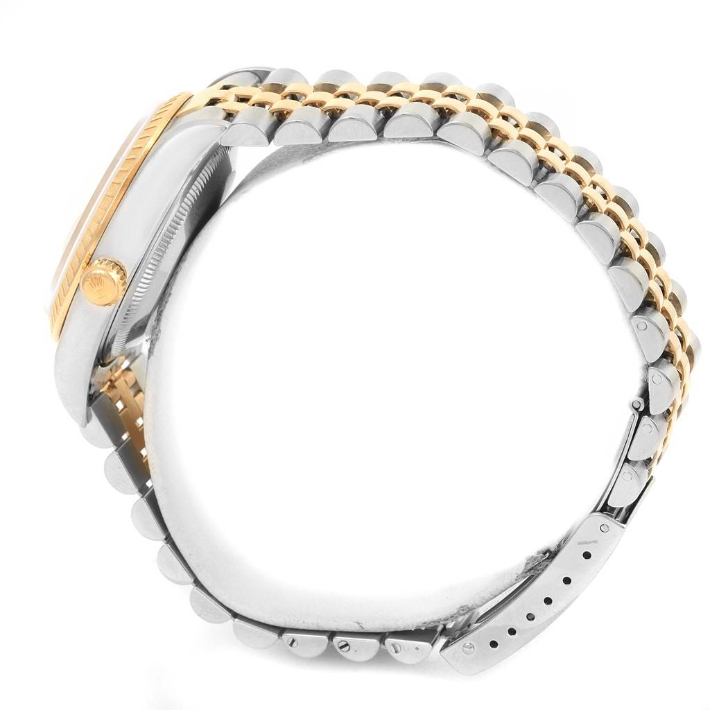 This image shows a side profile of a Rolex Date 15223 Men
s Steel and Gold (two tone) White Dial 15223 Men
s Steel and Gold (two tone) White Dial model, highlighting its crown, bezel, and two-tone bracelet.