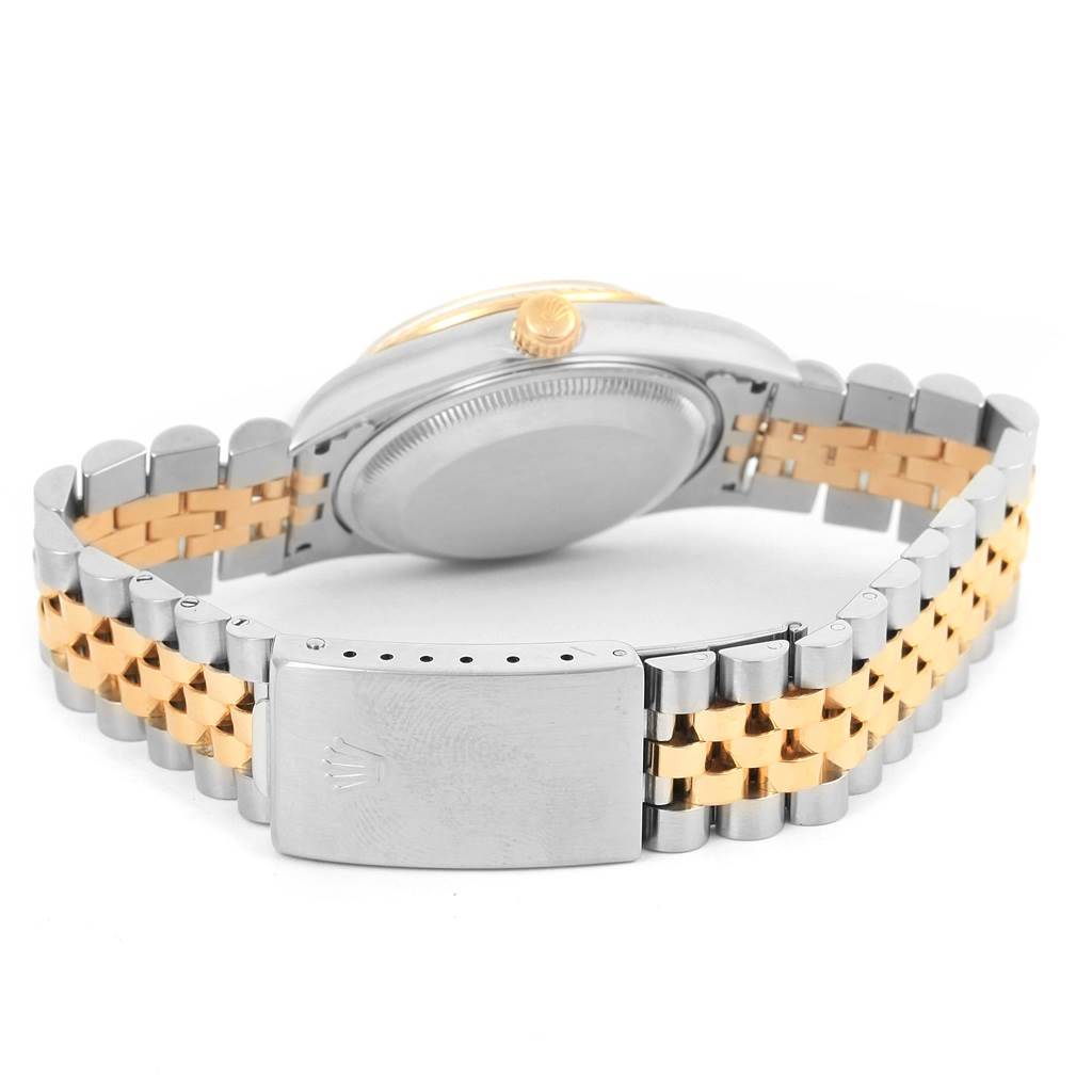 The image shows the clasp, bracelet, case back, and crown of a Rolex Date 15223 Men
s Steel and Gold (two tone) White Dial 15223 Men
s Steel and Gold (two tone) White Dial model watch from a rear angle.