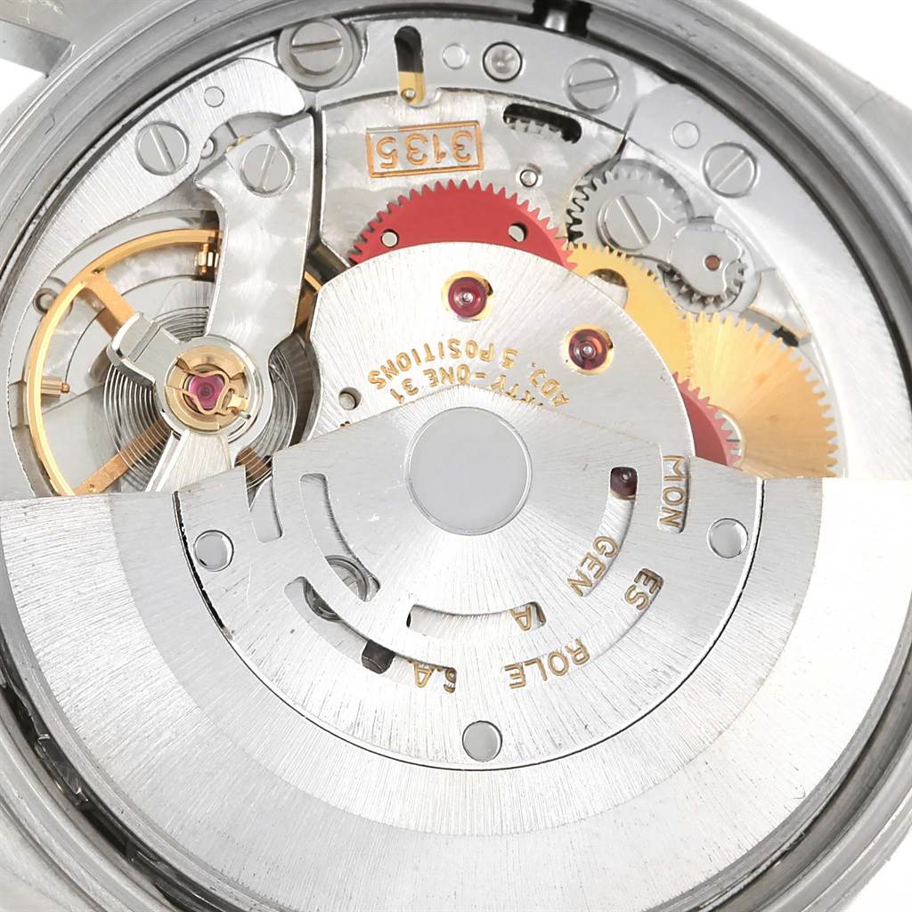 The image shows the internal mechanics and movement of a Rolex Date 15210 Men's Stainless Steel Silver Dial 15210 Men's Stainless Steel Silver Dial model watch.