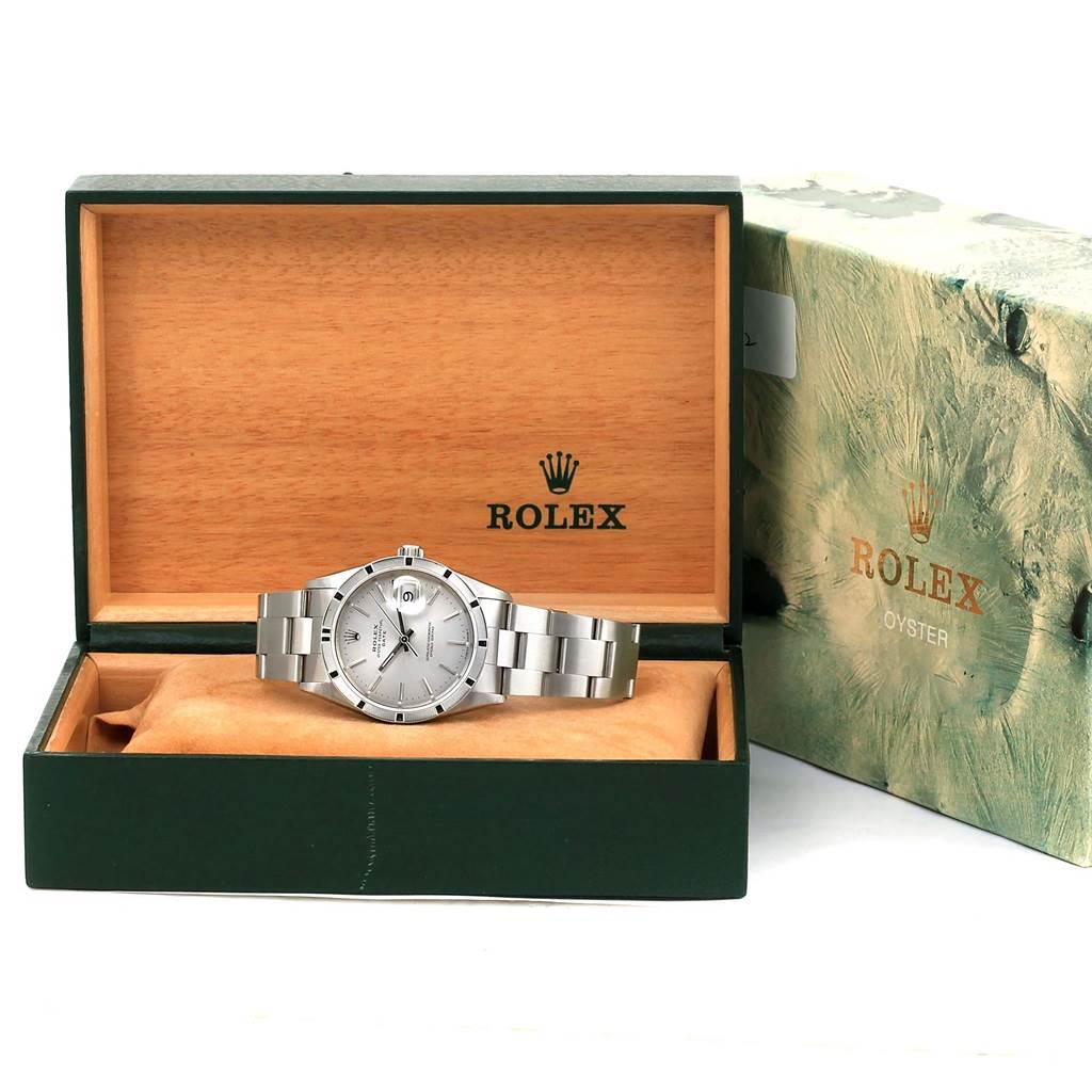 The Rolex Date 15210 Men's Stainless Steel Silver Dial 15210 Men's Stainless Steel Silver Dial model watch is shown from the front in its open presentation box along with the outer box visible to the side.