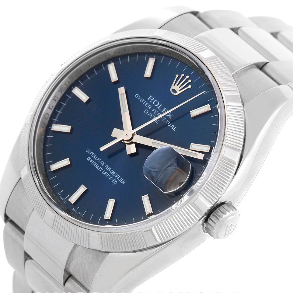 This image shows a Rolex Date 115210 Men's Stainless Steel Blue Dial 115210 Men's Stainless Steel Blue Dial model watch at an angle highlighting the dial, bezel, crown, and part of the bracelet.