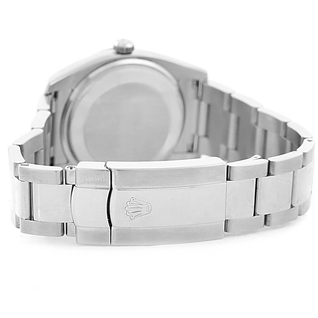 The image shows the back and bracelet clasp of a Rolex Date 115210 Men's Stainless Steel Blue Dial 115210 Men's Stainless Steel Blue Dial model watch at an angled view.