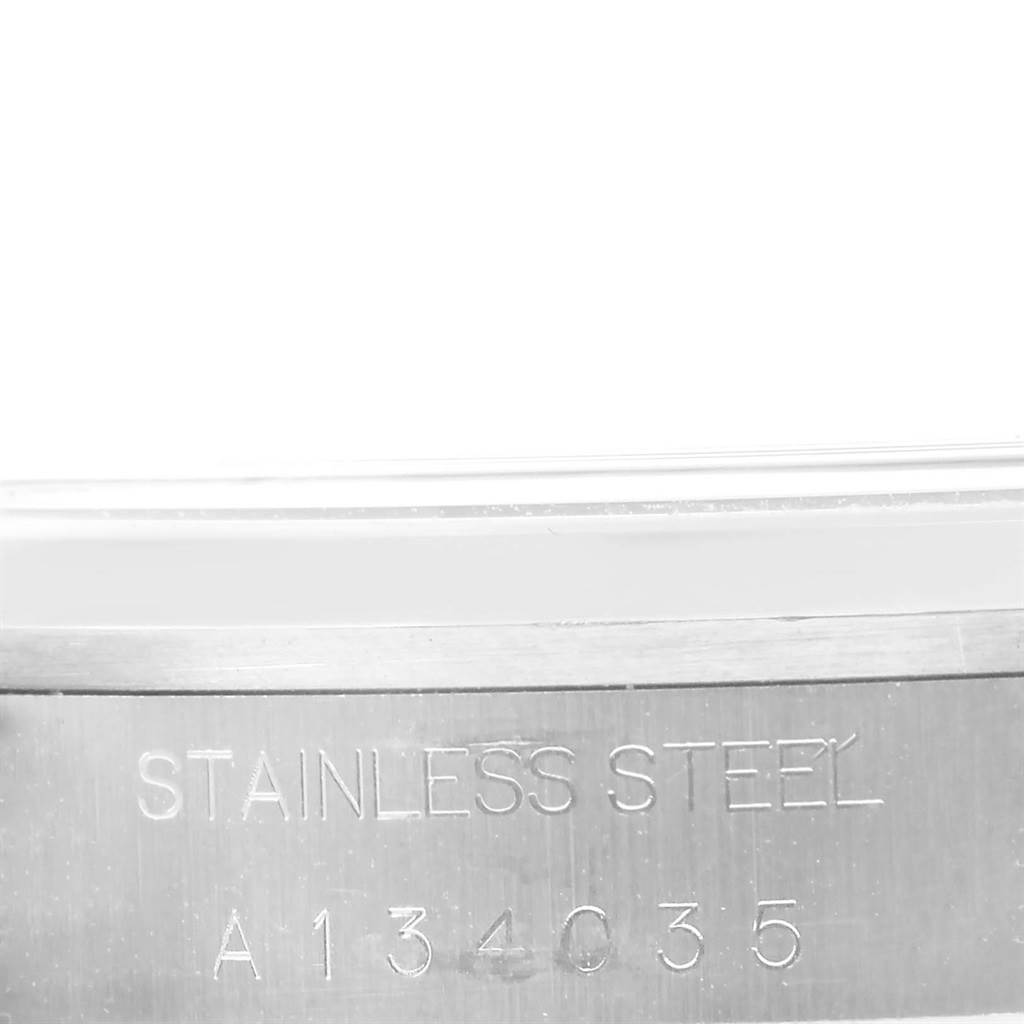 The image shows a close-up of the casing, identifying the serial number and material for the Rolex Date 15200 Men's Stainless Steel Black Dial 15200 Men's Stainless Steel Black Dial model watch.