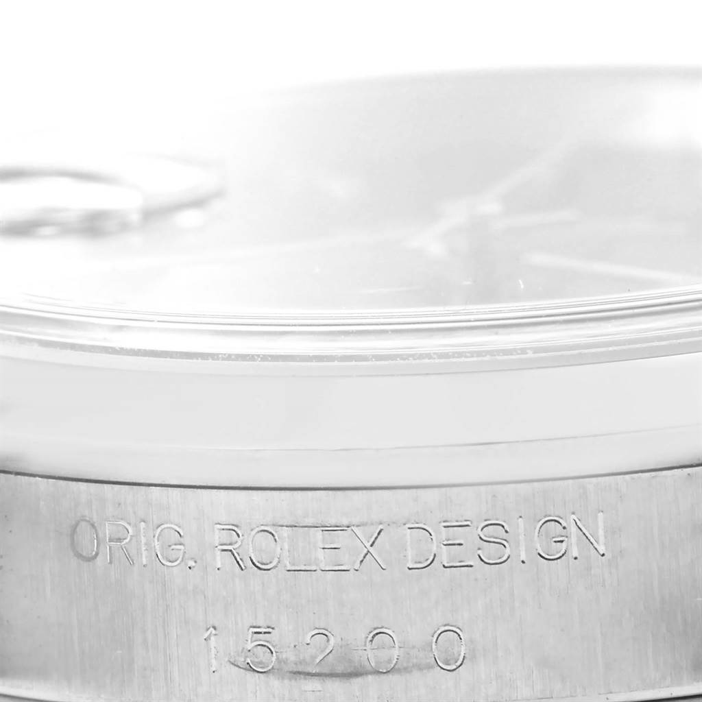 The image shows a close-up of the side of a Rolex Date 15200 Men's Stainless Steel Black Dial 15200 Men's Stainless Steel Black Dial model watch, revealing the "Orig. Rolex Design" engraving and model number 15200.