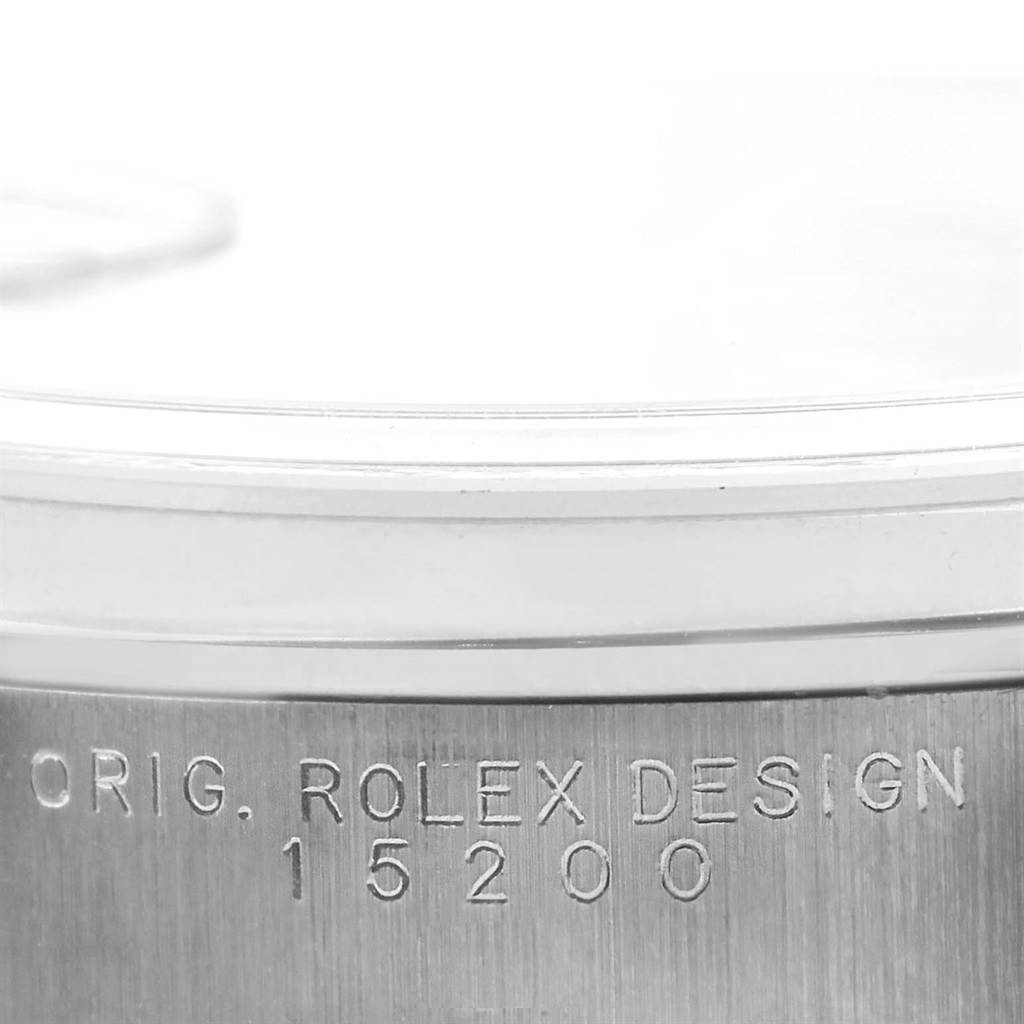 The image shows a close-up of the side of a Rolex Date 15200 Men
s Stainless Steel Black Dial 15200 Men
s Stainless Steel Black Dial, revealing the model number 15200 and "Orig. Rolex Design" inscription.