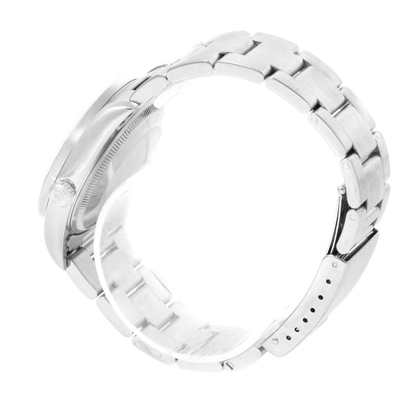 This image shows a Rolex Date 15210 Men's Stainless Steel Blue Dial 15210 Men's Stainless Steel Blue Dial model watch from a side angle, highlighting its bracelet and clasp.