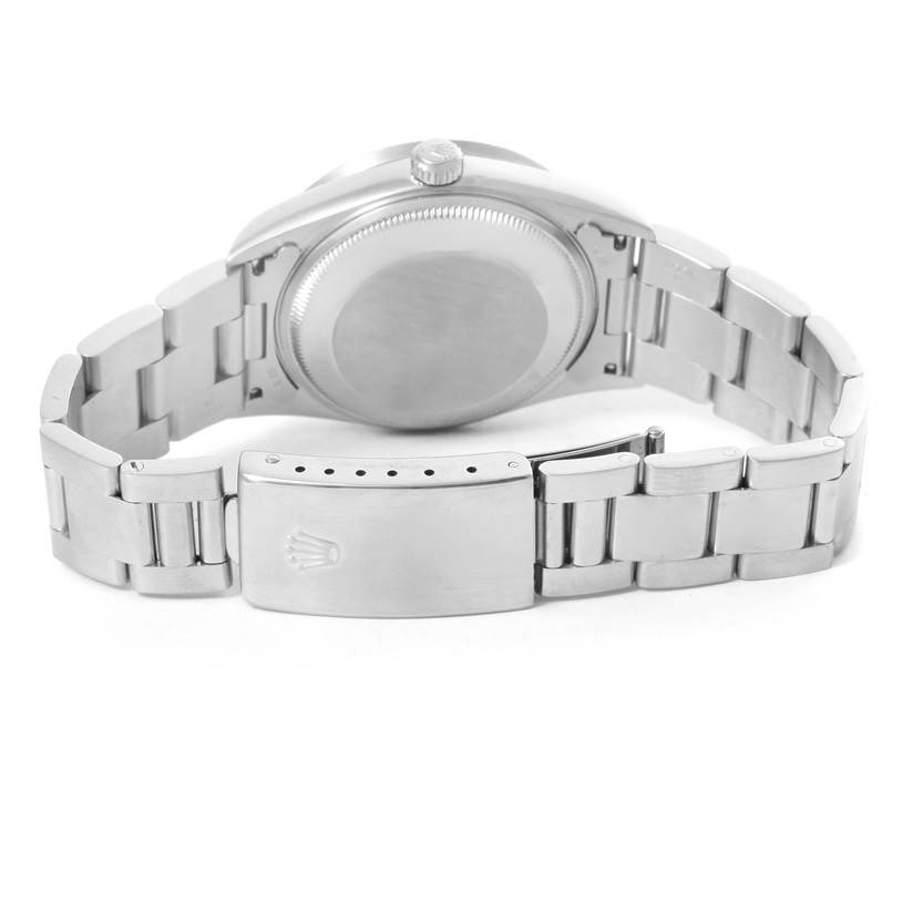 The image shows the back view of the Rolex Date 15210 Men's Stainless Steel Blue Dial 15210 Men's Stainless Steel Blue Dial model watch, focusing on the case back and the bracelet clasp.