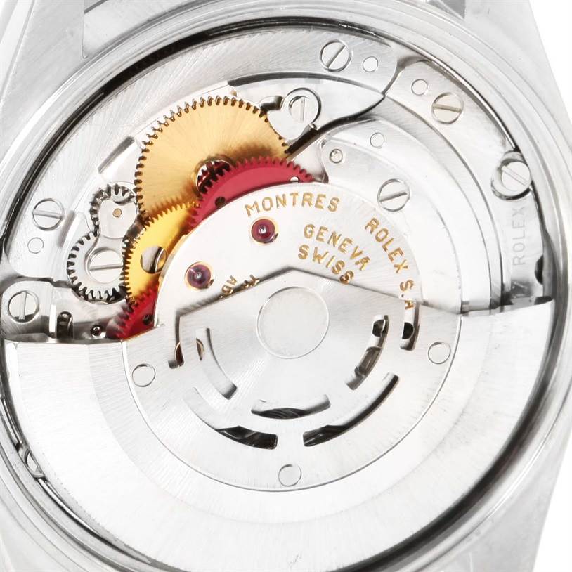 This is an angled close-up view of the internal mechanism of a Rolex Date 15210 Men's Stainless Steel Blue Dial 15210 Men's Stainless Steel Blue Dial model watch, showcasing its gears and movement components.