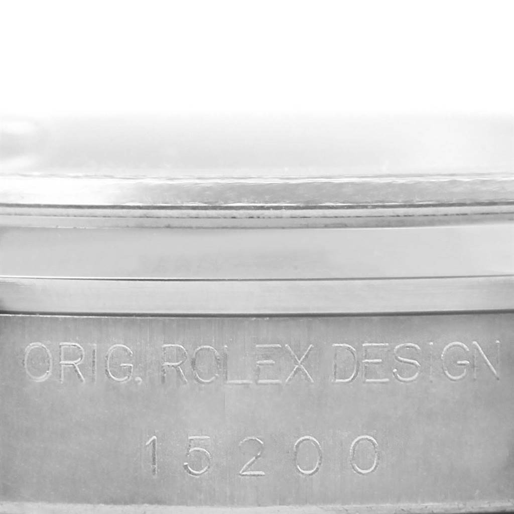 This image shows a close-up of the side case of a Rolex Date 15200 Men
s Stainless Steel Silver Dial 15200 Men
s Stainless Steel Silver Dial model, displaying the engravings "ORIG. ROLEX DESGN" and "15200."
