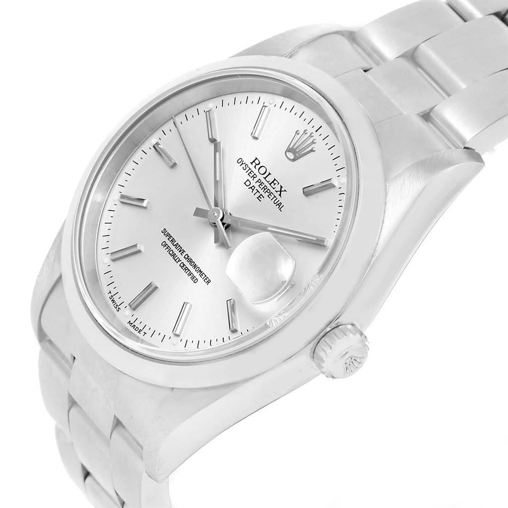 This image shows a close-up side angle of a Rolex Oyster Perpetual Date watch, highlighting the dial, bezel, crown, and part of the bracelet.