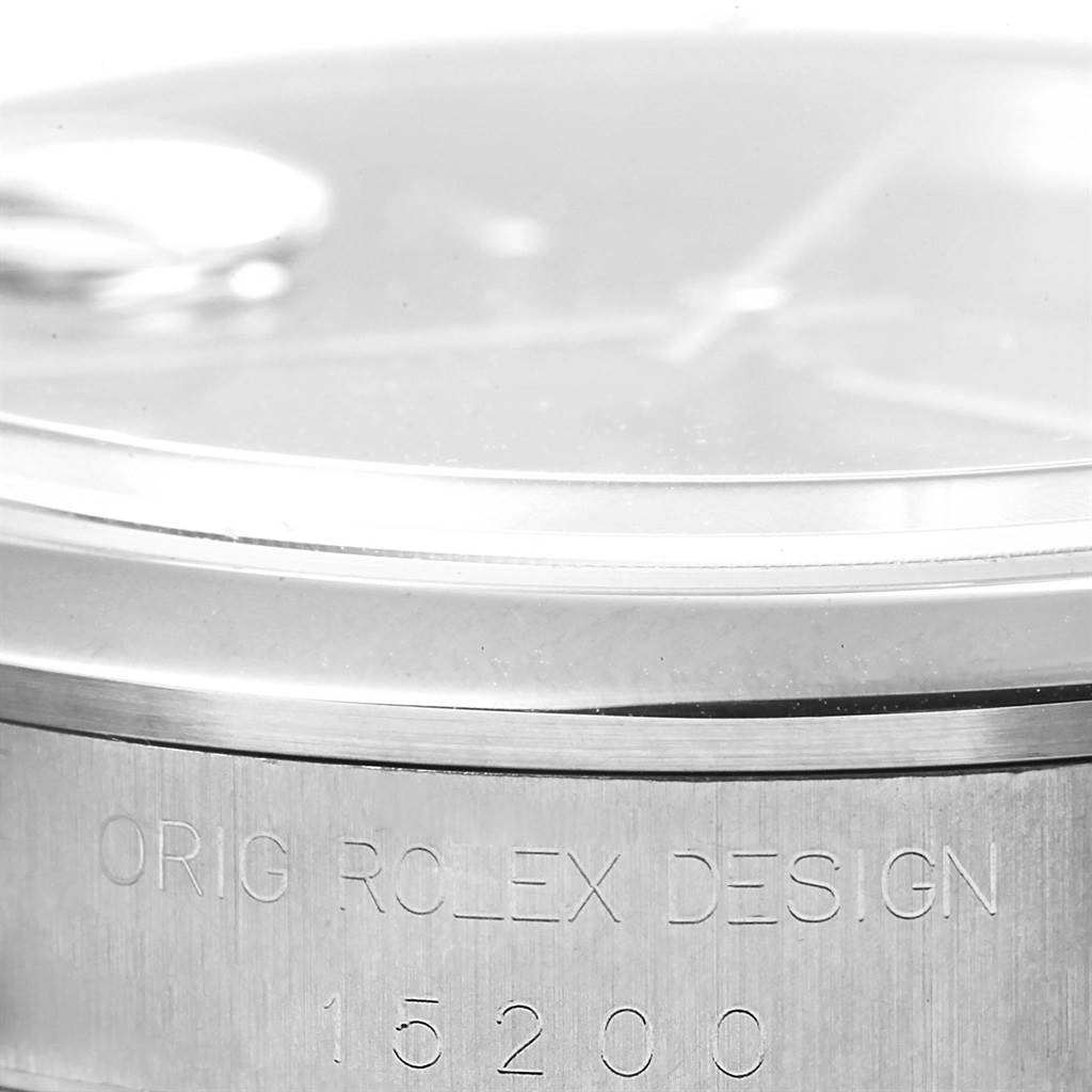 The image shows a close-up of the Rolex Date 15200 Men's Stainless Steel Black Dial 15200 Men's Stainless Steel Black Dial model's bezel and engraved case side with the model number.
