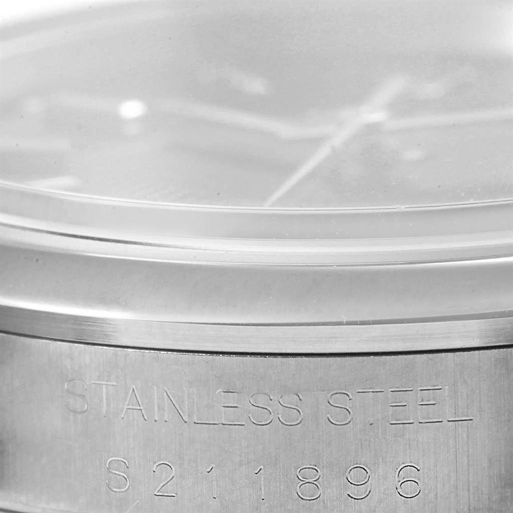 The image shows a close-up angle of the serial number and stainless steel engraving on a Rolex Date 15200 Men's Stainless Steel Black Dial 15200 Men's Stainless Steel Black Dial model watch case.