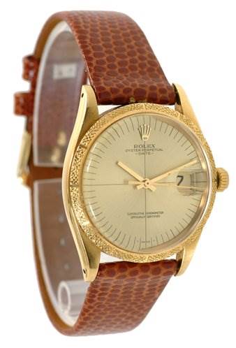 This image shows a Rolex Date 1510 Men's Yellow Gold Champagne Dial 1510 Men's Yellow Gold Champagne Dial model watch at an oblique angle, highlighting the face, leather strap, and crown.