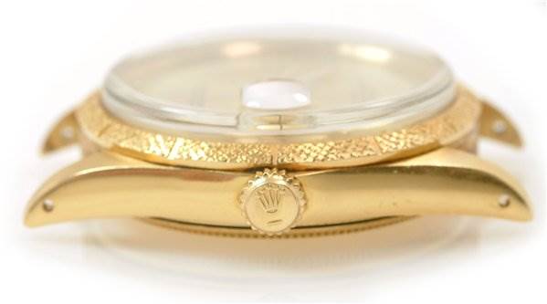 The image shows a side view of a Rolex Date 1510 Men's Yellow Gold Champagne Dial 1510 Men's Yellow Gold Champagne Dial model watch, focusing on the crown and part of the case.