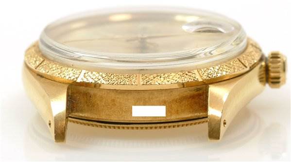 This image shows a side view of a Rolex Date 1510 Men's Yellow Gold Champagne Dial 1510 Men's Yellow Gold Champagne Dial model watch, highlighting the case, crown, and bezel.