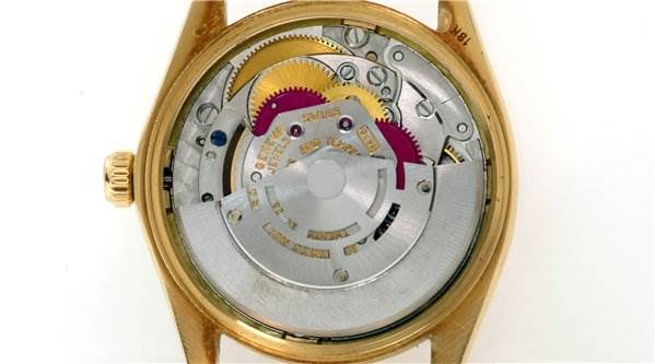 This image shows the movement mechanism of a Rolex Date 1510 Men's Yellow Gold Champagne Dial 1510 Men's Yellow Gold Champagne Dial model watch with the case back removed.