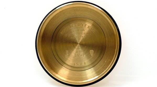 This image shows the inside of the case back of a Rolex Date 1510 Men's Yellow Gold Champagne Dial 1510 Men's Yellow Gold Champagne Dial model watch, viewed from directly above.