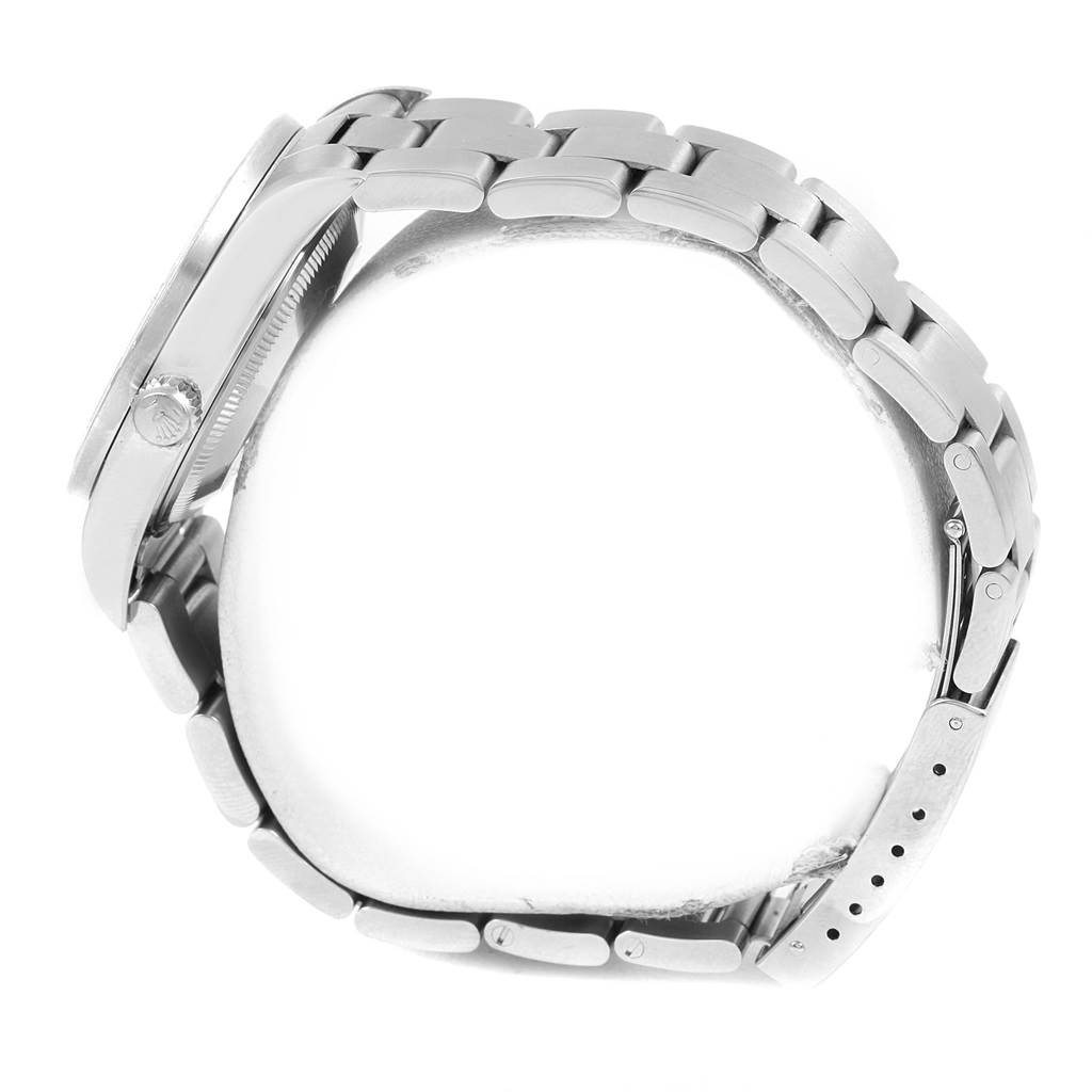 This image shows a side profile of a Rolex Date 15210 Men's Stainless Steel Silver Dial 15210 Men's Stainless Steel Silver Dial model watch, highlighting the bracelet, clasp, and case sides.