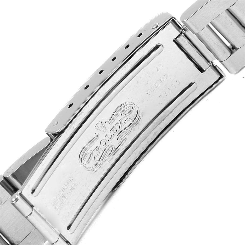 The image shows the clasp of a Rolex Date 15210 Men's Stainless Steel White Dial 15210 Men's Stainless Steel White Dial model wristwatch, highlighting its engravings and metallic finish.