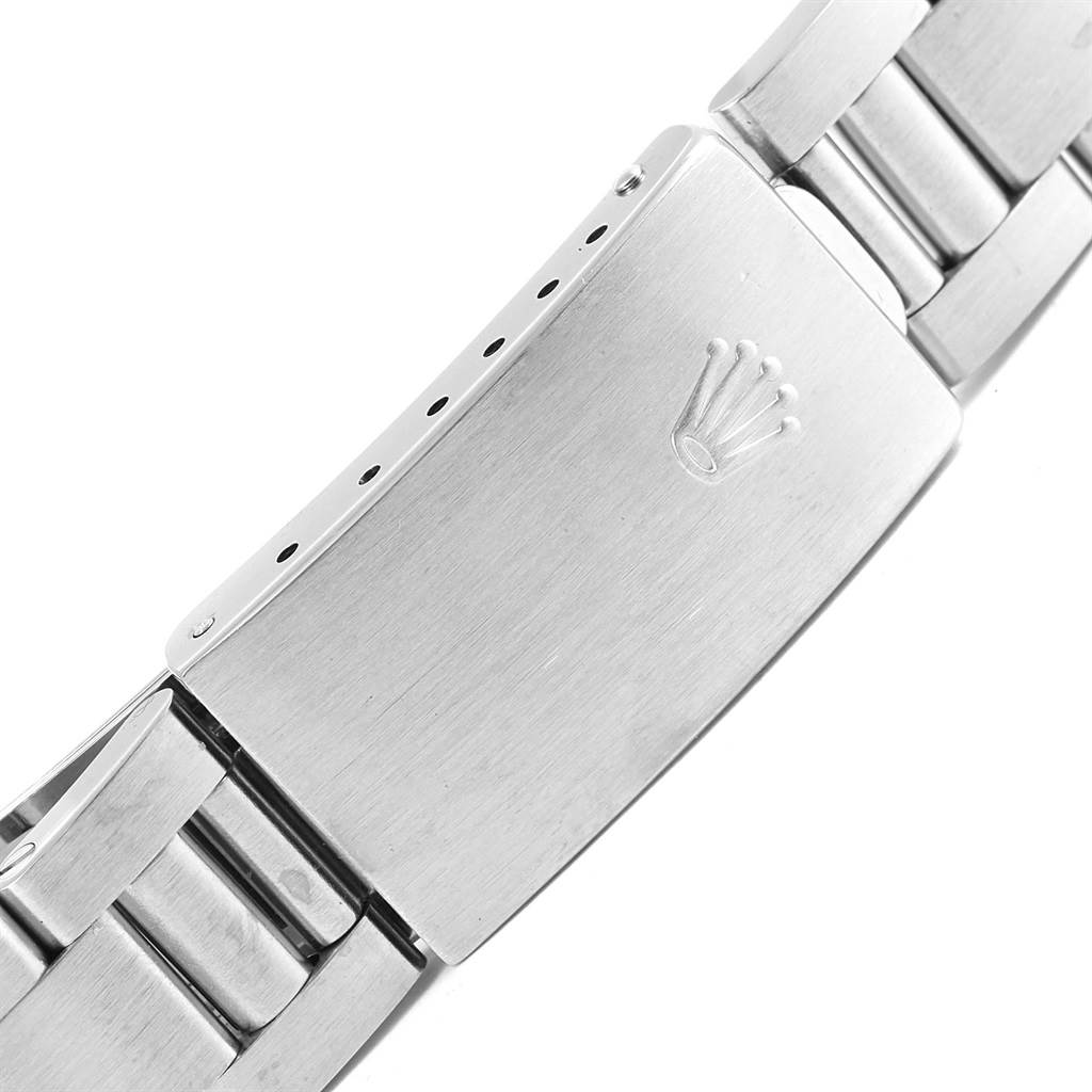 The image shows a close-up of the clasp and part of the bracelet of a Rolex Date 15210 Men's Stainless Steel White Dial 15210 Men's Stainless Steel White Dial model watch.