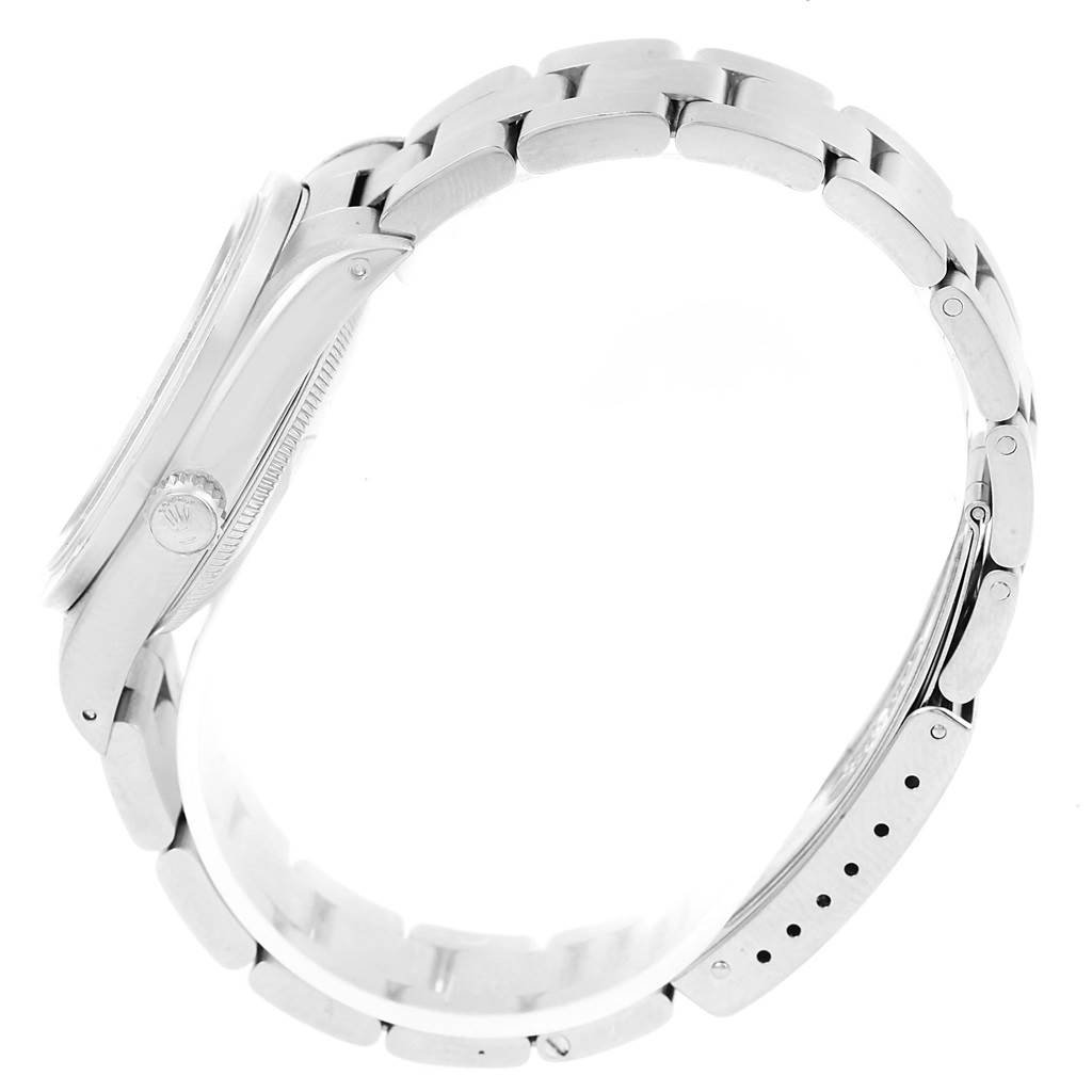 The image shows a side view of a Rolex Date 15210 Men's Stainless Steel Silver Dial 15210 Men's Stainless Steel Silver Dial model watch, highlighting the bracelet, clasp, and crown.