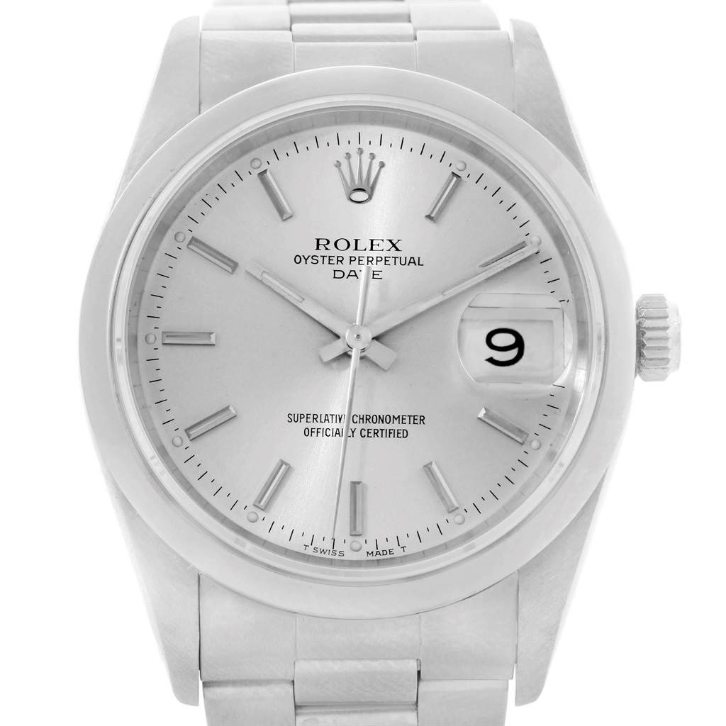 The image shows a front view of a Rolex Oyster Perpetual Date watch, highlighting the dial, hands, and date window.