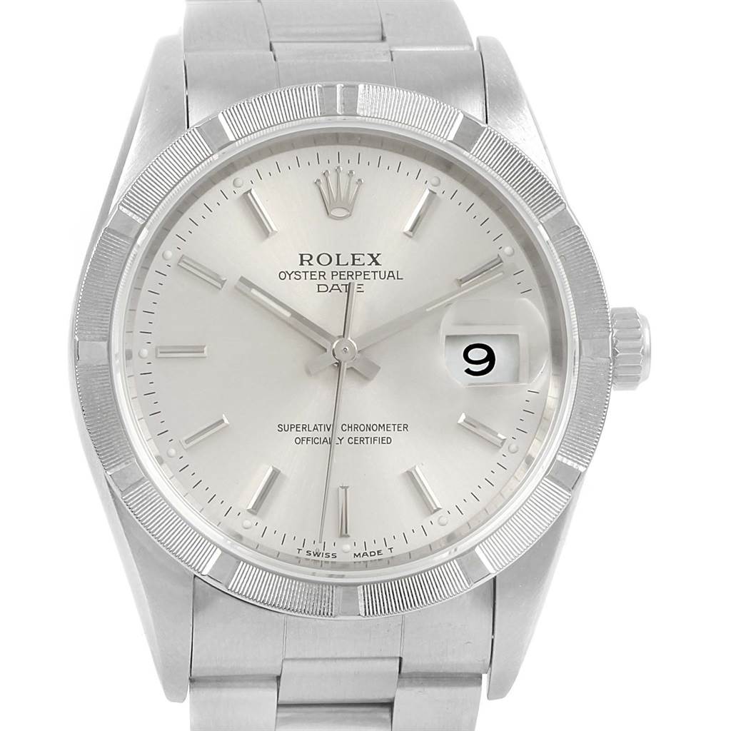 The image shows a Rolex Oyster Perpetual Date watch from a front angle, highlighting its dial, bezel, and bracelet.