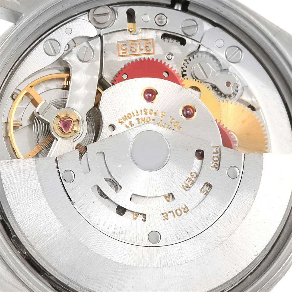 The image shows the internal mechanism of a Rolex Date 15210 Men's Stainless Steel Silver Dial 15210 Men's Stainless Steel Silver Dial model watch, specifically the movement and rotor parts.