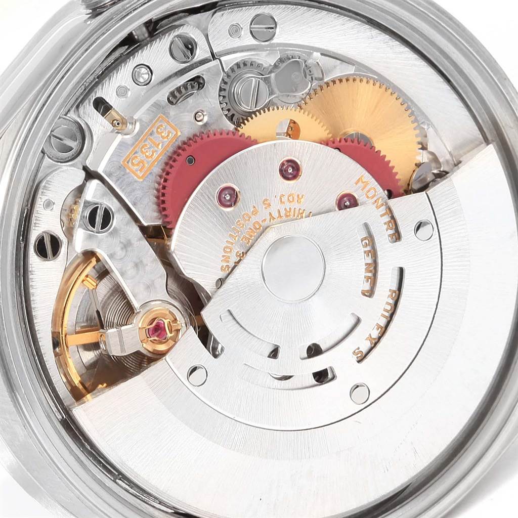 This image shows the internal mechanism of a Rolex Date 15210 Men's Stainless Steel Blue Dial 15210 Men's Stainless Steel Blue Dial model watch, highlighting gears and the rotor at an angled view.