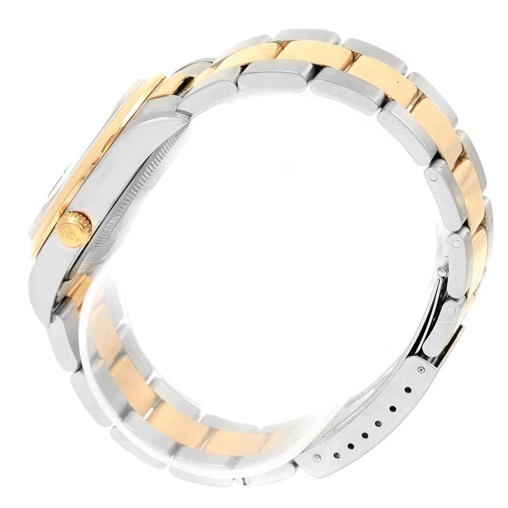 The image shows a side angle of a Rolex Date 15203 Men's Steel and Gold (two tone) Black Dial 15203 Men's Steel and Gold (two tone) Black Dial model, highlighting its two-tone bracelet, case, and crown.