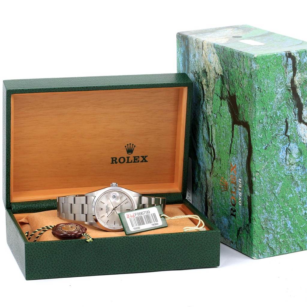 The Rolex Date 15200 Men's Stainless Steel Silver Dial 15200 Men's Stainless Steel Silver Dial model watch is displayed inside its open box, with its bracelet, tag, and accessories visible.