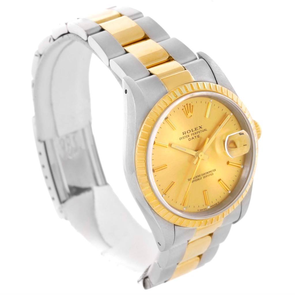 The image shows a side-angle view of a Rolex Date 15223 Men's Steel and Gold (two tone) Champagne Dial 15223 Men's Steel and Gold (two tone) Champagne Dial model watch, highlighting its dial, bezel, crown, and two-tone bracelet.