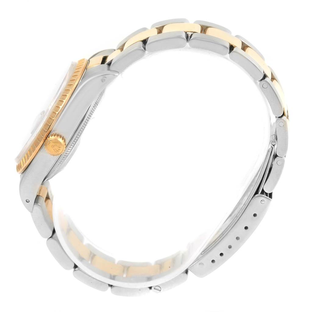 The image shows a side profile of a Rolex Date 15223 Men's Steel and Gold (two tone) Champagne Dial 15223 Men's Steel and Gold (two tone) Champagne Dial model watch, highlighting its case, crown, and two-tone bracelet.