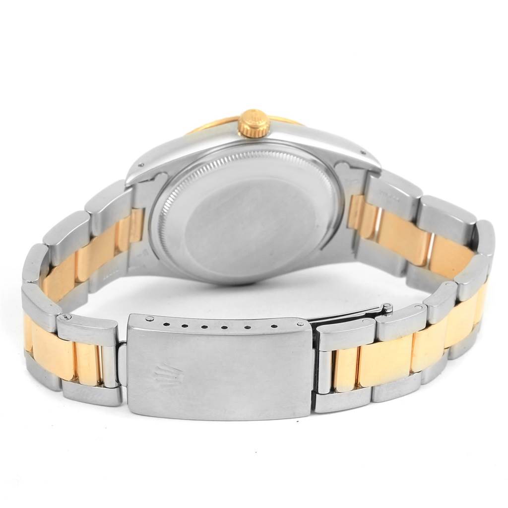 This image shows the back and clasp of a Rolex Date 15223 Men's Steel and Gold (two tone) Champagne Dial 15223 Men's Steel and Gold (two tone) Champagne Dial watch, highlighting its two-tone bracelet.